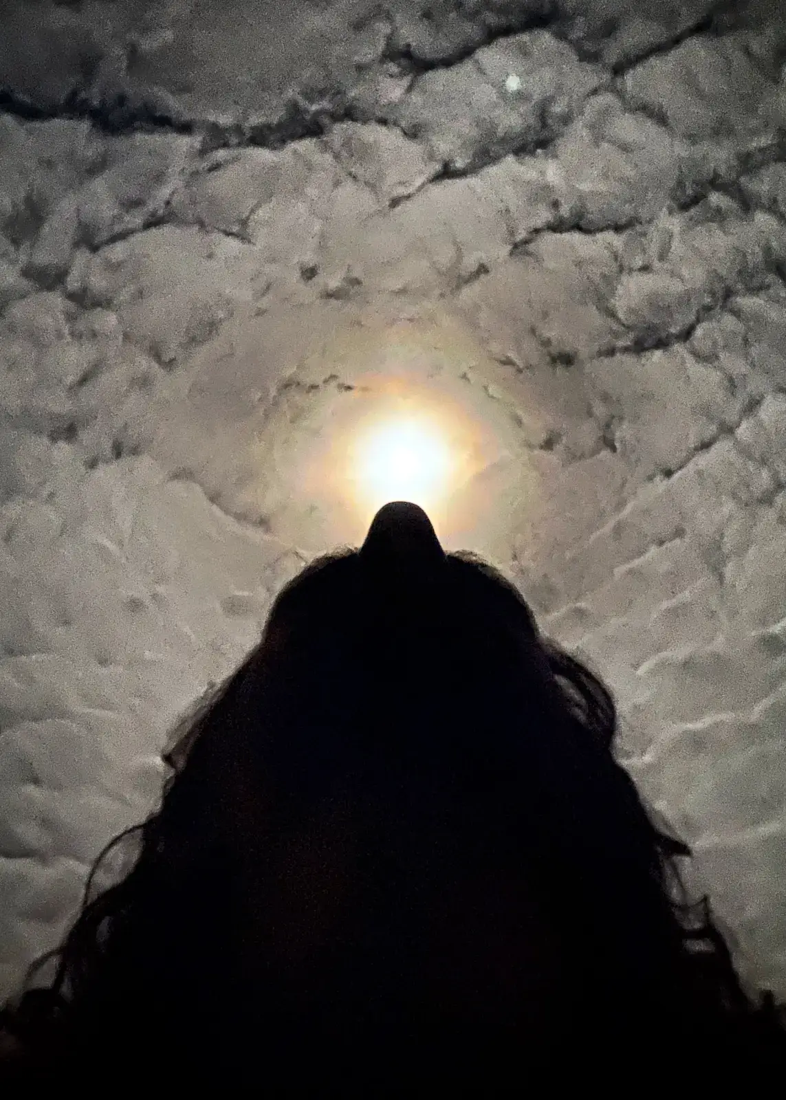 Silhouette of Matt Ketchum aka MKUltraman, a creative consultant Japan focused on strategy in front of a full moon on Hachijojima in Tokyo, Japan