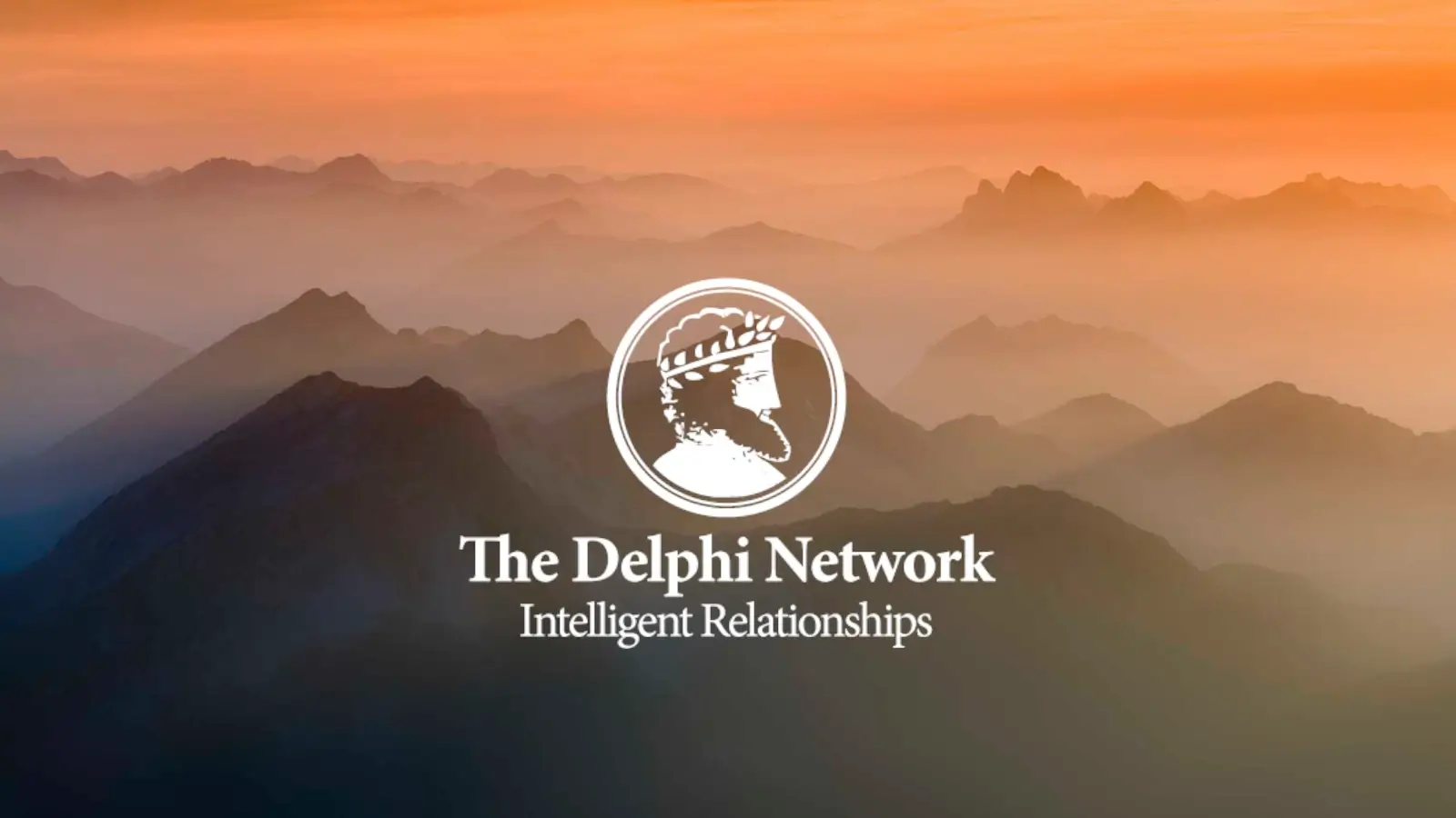 The Delphi Network logo superimposed over a mountain range at sunset.