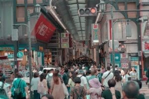 Crowded Japanese shopping street illustrating the public context surrounding Japanese immigration, local administration, and daily residency logistics.